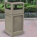 A beige rectangular Commercial Zone waste container with an ashtray dome lid on a brick surface.