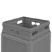 A close-up of a gray plastic Commercial Zone waste container and dome lid.