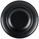 A close up of a Hall China black china bowl with a circular edge.
