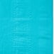 A Bermuda blue table cover with a square design on it.