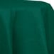 A Hunter Green Creative Converting table cover on a table.