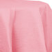 A Classic Pink OctyRound table cover on a table.