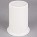 a white plate on a gray surface