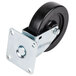 A black caster wheel with a metal plate.