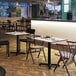 A FLAT Tech black table base on a restaurant table.