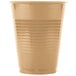 A beige plastic cup on a white surface.