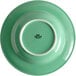 A green Tuxton china bowl with a white rim.