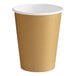 A brown paper cup with a white rim and gold glitter accents.