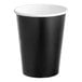 A white bowl with a black and white Creative Converting paper cup inside.