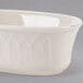 A white oval shaped bowl with a curved design.