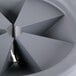 A grey circular InSinkErator safety baffle with a triangle cut out.