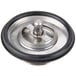 An InSinkErator sink flange mounting assembly with black and silver metal parts and a black rubber ring.