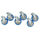 A set of six blue and silver swivel stem casters with wheels.