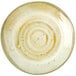 A white and brown ceramic Carlisle charger plate with a circular design on a white surface.