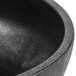 A black polypropylene molcajete with a black rim.