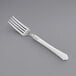 A Visions heavy weight plastic fork with a white handle.