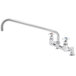 A chrome T&S deck-mounted faucet with two handles.