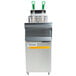 A Frymaster natural gas floor fryer with green handles.