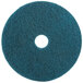 A white circle on a blue 3M floor pad.