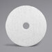 A white circular 3M Super Polishing floor pad.