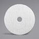 A white circular 3M Super Polishing pad