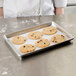 A Chicago Metallic aluminum sheet pan with cookies on it.