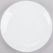 A white Chef & Sommelier bone china plate with a white rim on a gray surface.