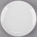 A white Arcoroc porcelain salad plate with a white rim.