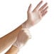 a person putting on gloves