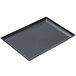 A black rectangular tray with a circle on the bottom.