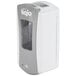 A close-up of a white and grey GOJO® touchless hand soap dispenser.