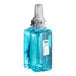 A blue plastic bottle of GOJO Botanical foaming hand soap.