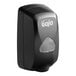A black touchless hand soap dispenser with the GOJO logo on the front.