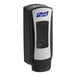 A black and silver Purell® hand sanitizer dispenser.