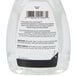 A close up of a green and white GOJO hand soap bottle with a pump.