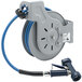 A T&S open hose reel with a hose attached.