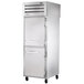 A white True pass-through freezer with silver handles on the doors.