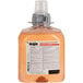 A bottle of GOJO Fresh Fruit foaming antibacterial hand soap with a grey cap.