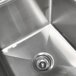 A stainless steel Advance Tabco one compartment pot sink with two drainboards.