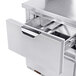 A stainless steel Beverage-Air worktop freezer drawer open.