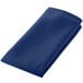 A folded royal blue Intedge cloth napkin.