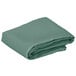 A folded seafoam green Intedge table cover.