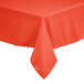 An orange Intedge square cloth table cover on a table outdoors.