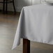 A table with a gray Intedge rectangular tablecloth.