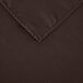 A close up of a dark brown rectangular Intedge cloth table cover.