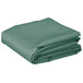 A stack of folded seafoam green rectangular table covers.