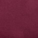 A close-up of a burgundy Snap Drape Contour Table Cover.