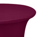 A burgundy Snap Drape spandex table cover on a round table.