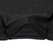 A close up of a black round fabric with a black triangle.