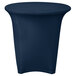 A navy blue Snap Drape Contour spandex table cover on a round table.